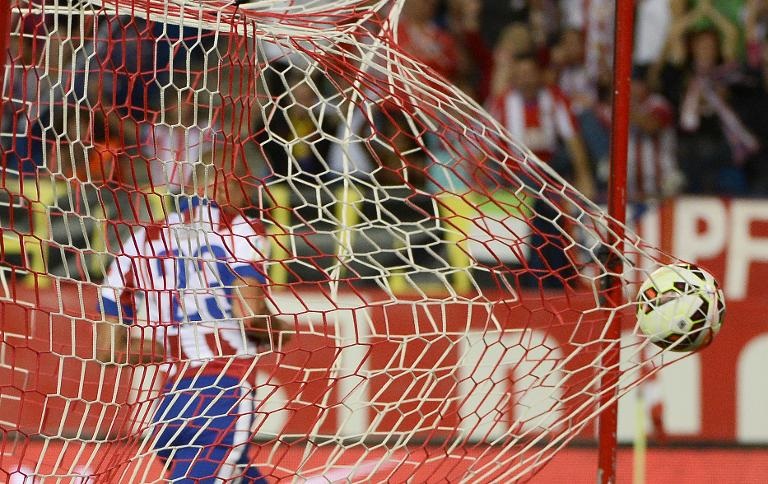 Hậu vệ người Brazil Joao Miranda của Atletico Madrid ăn mừng bàn thắng trong trận đấu với Celta Vigo