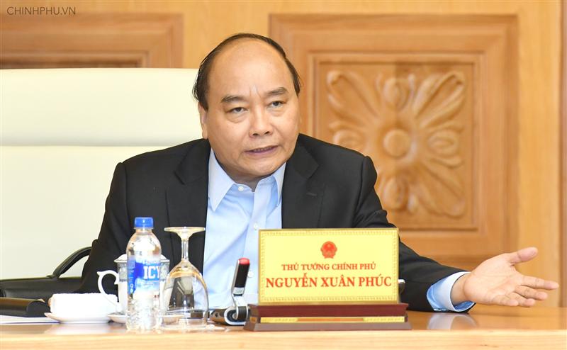 Thủ tướng Nguyễn Xuân Phúc chủ trì phiên họp Thường trực Chính phủ thảo luận về dự thảo Nghị quyết 01 của Chính phủ. Ảnh: VGP/Quang Hiếu 